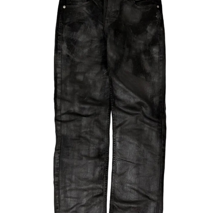 WithoutSaint oil spill skinny denim jeans, close-up of distressed denim fabric with unique oil stain pattern and slim fit design.