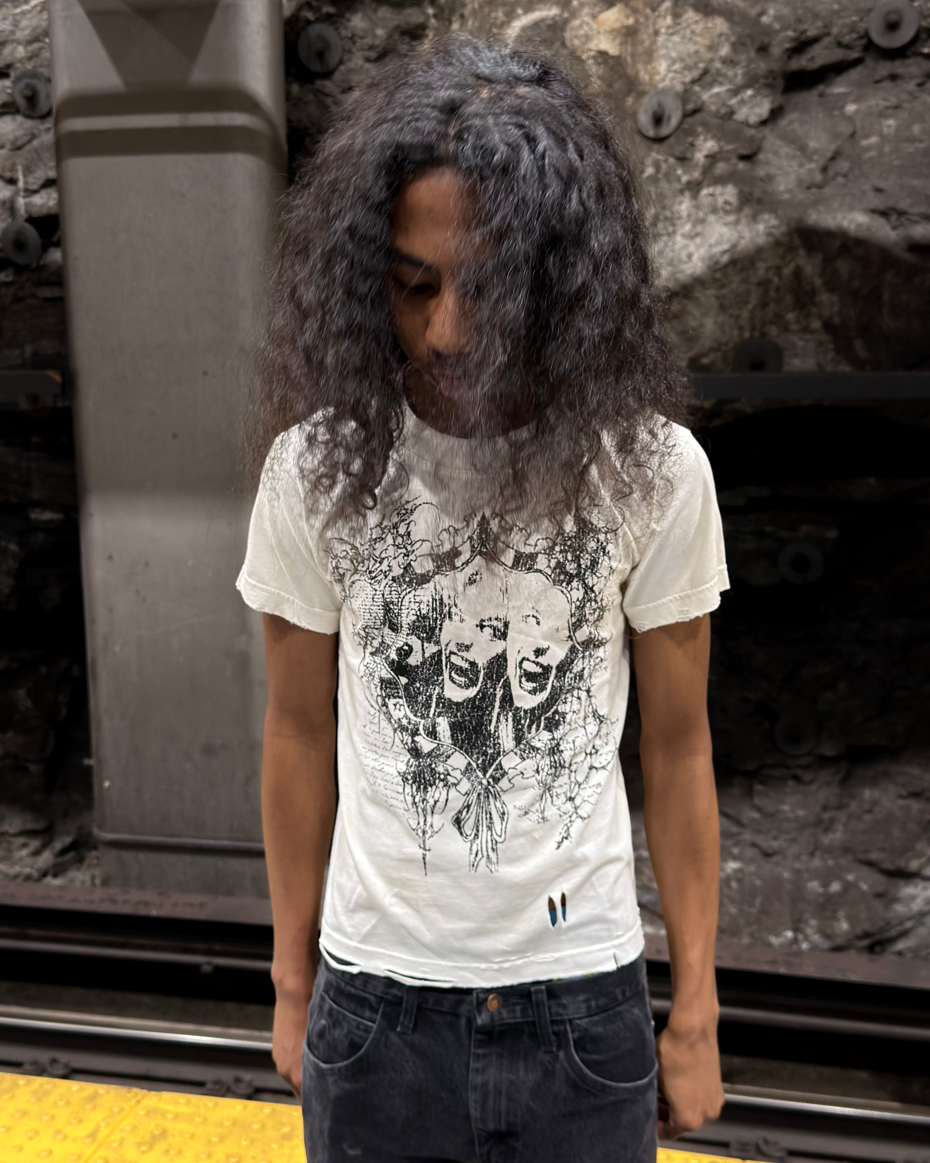 WithoutSaint seeing faces tee featuring a colorful graphic print on a black cotton t-shirt.